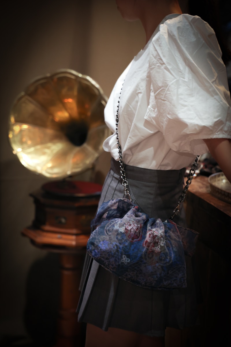 a woman in a skirt holding a purse