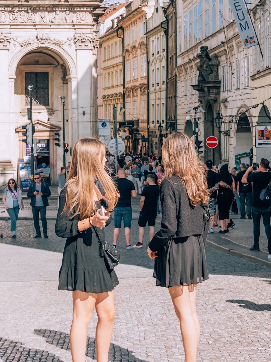two young women standing on a city street